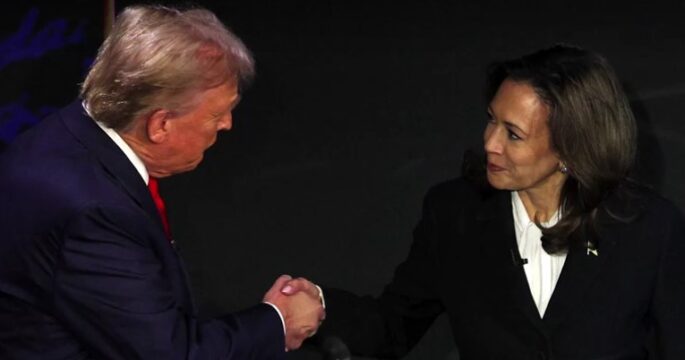 Donald Trump and Kamala Harris shake hand