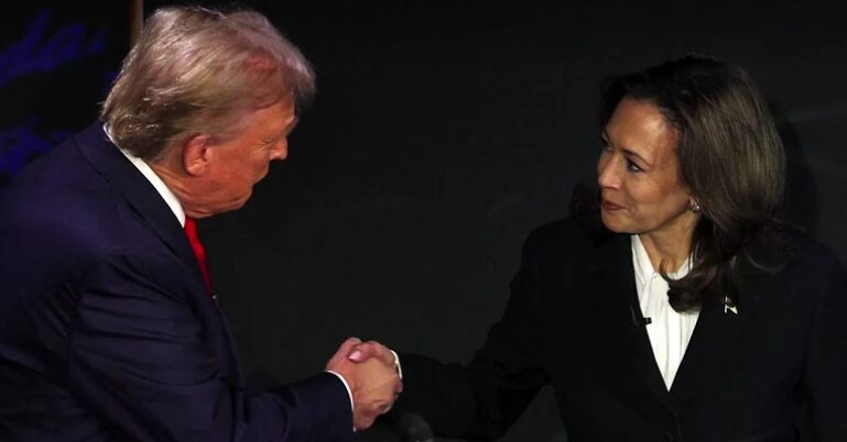 Donald Trump and Kamala Harris shake hand