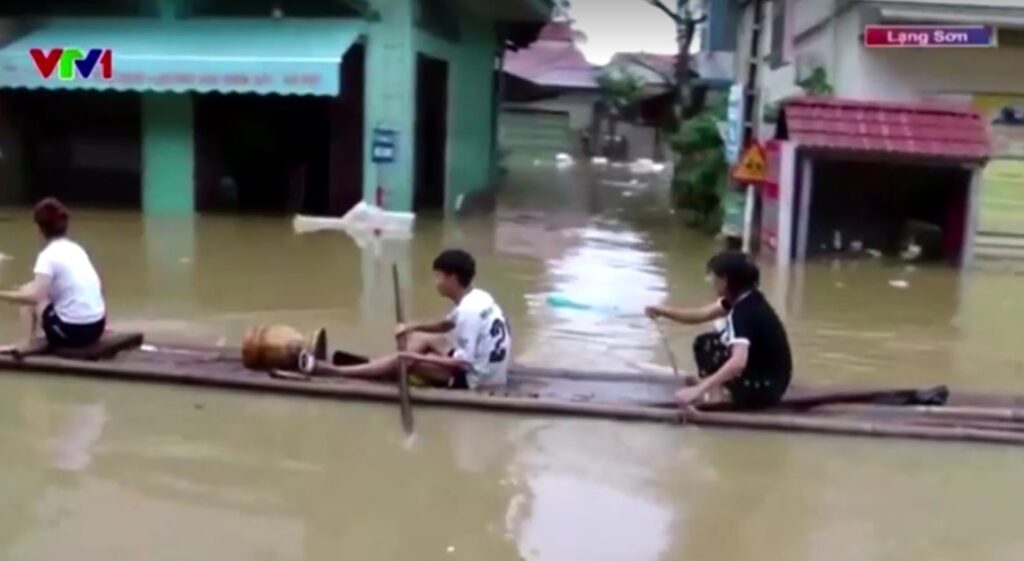 people use boat in flooding Vietnam