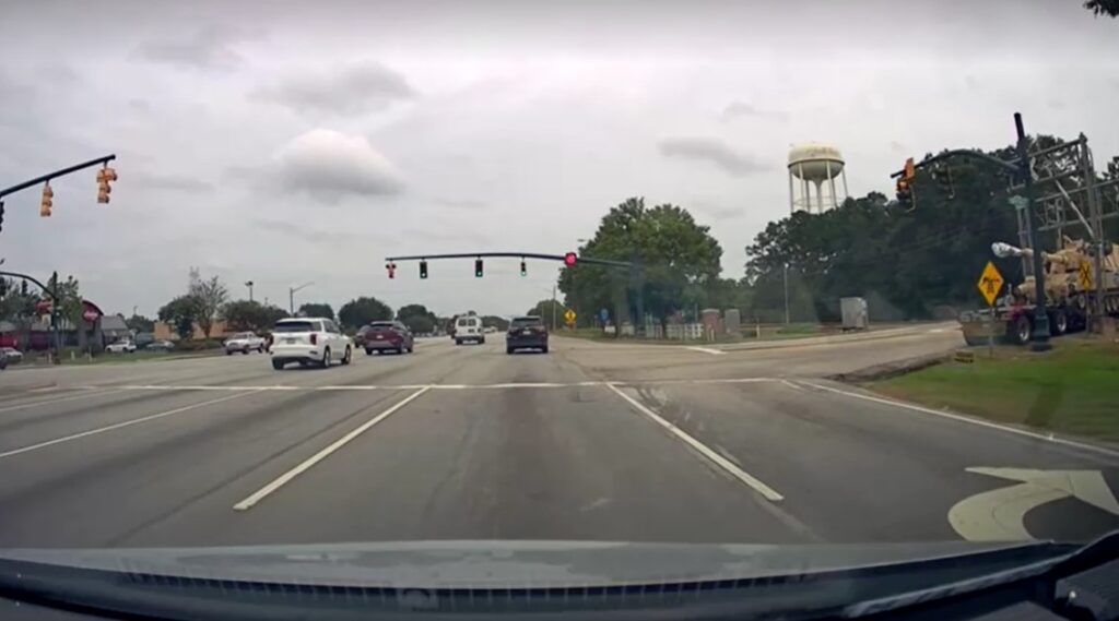 freight train collides with semi-truck hauling military tank