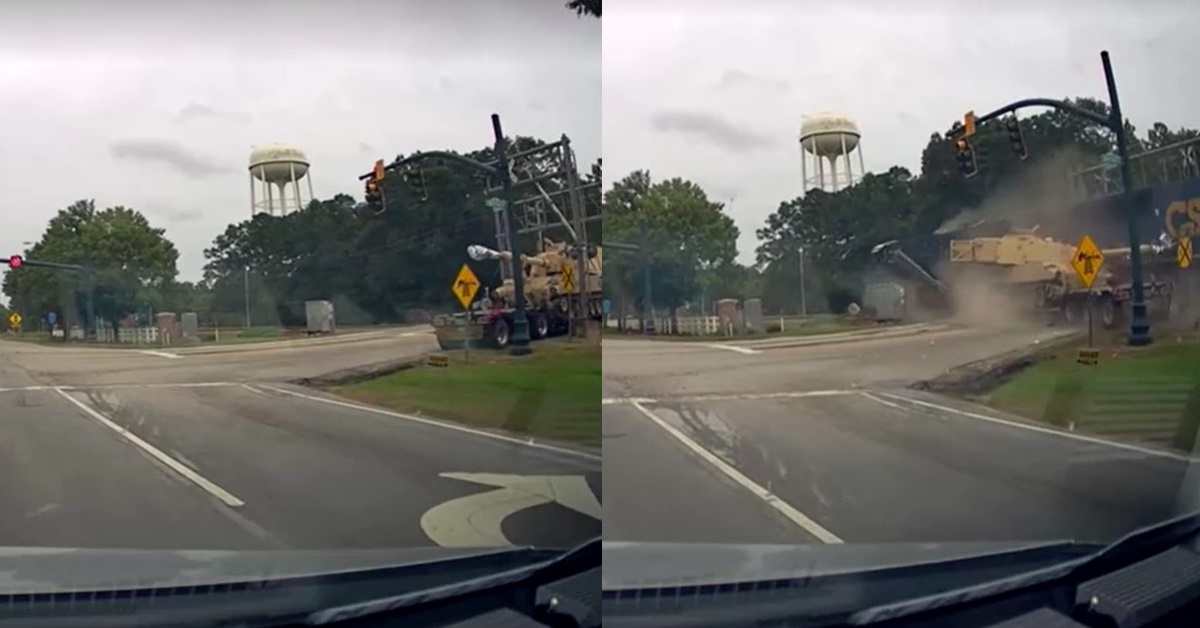 freight train collides with semi-truck hauling military tank