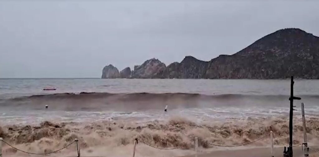 Mudy waves breaking at beach in Mexico