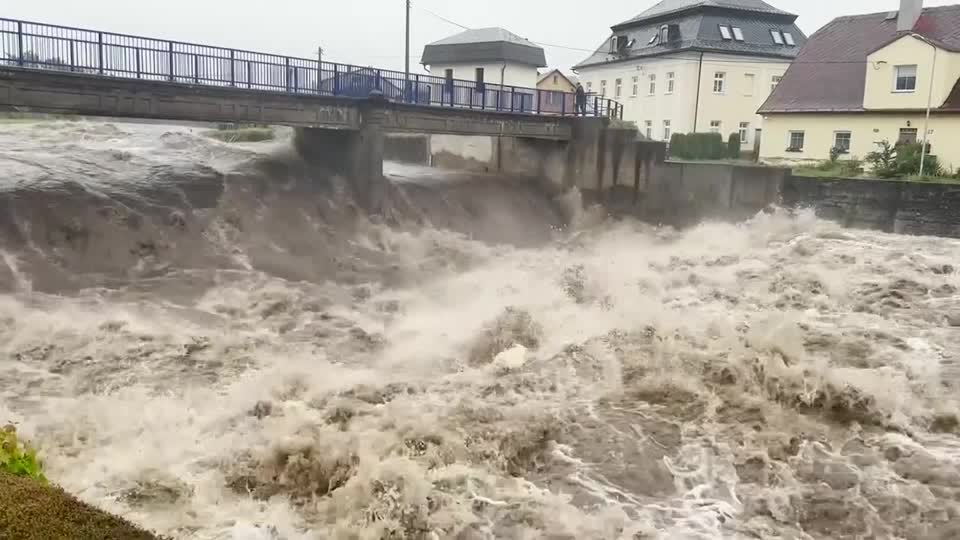 rapid flowing river under bridge in Czech Republic