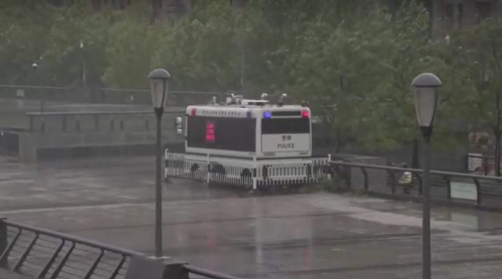 a police vehicle on standby at riverbank in Shanghai China