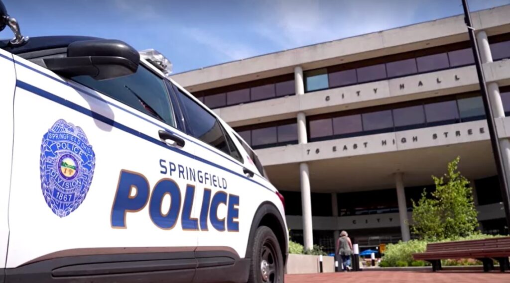 Springfield City Hall with a police car