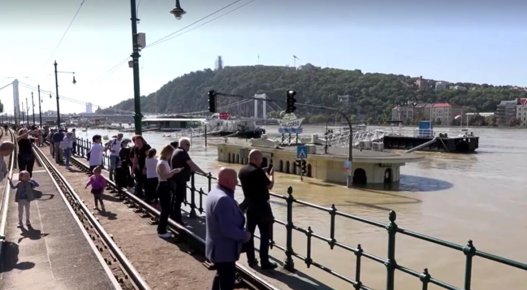 Tourists and locals alike watched and took pictures as the swollen Danube river