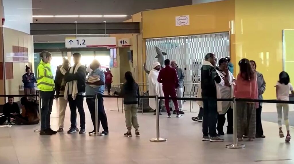 passengers waiting after security threat grounds Air India flight in Canada's Iqaluit airport