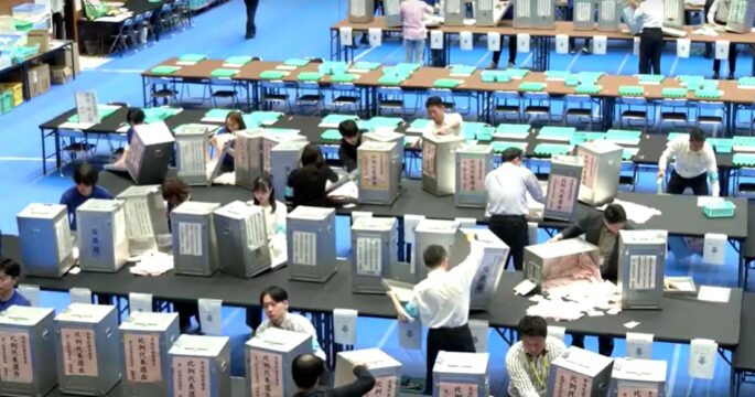 Japan election officers gather voting ballot longshot