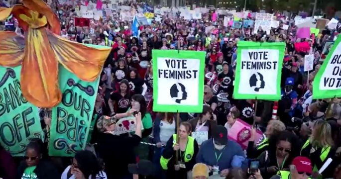 Thousands rally for women's rights in Washington ahead of presidential election