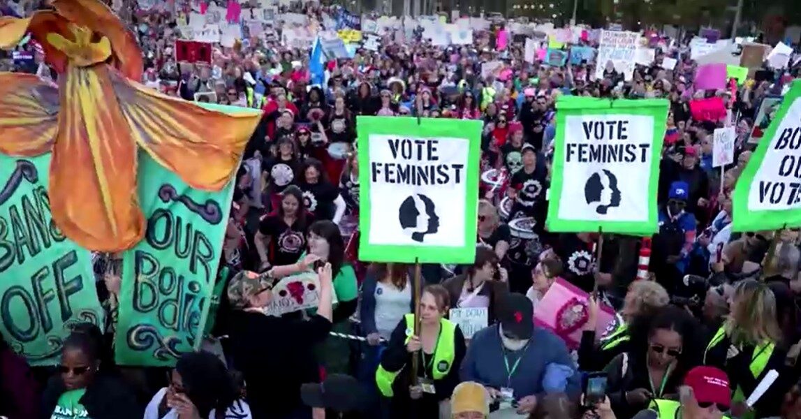 Thousands rally for women's rights in Washington ahead of presidential election