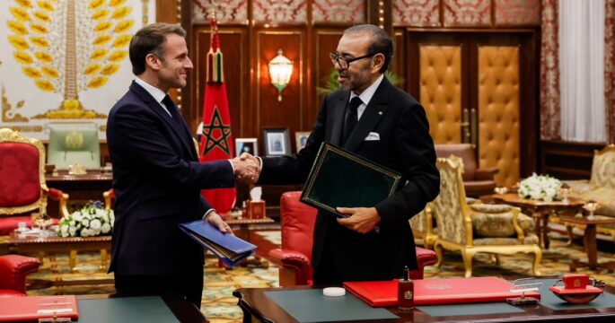 Leaders of Morocco and France shaking hands