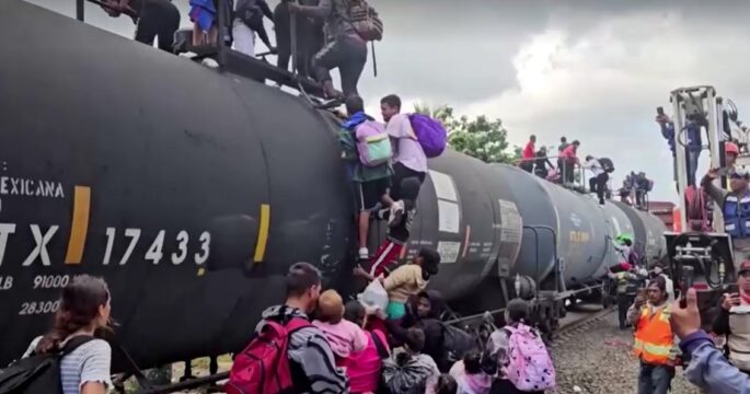 migrant families risk life and limb to jump Mexico train