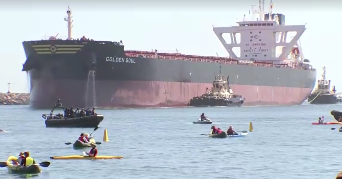 Australia climate change protest forces ship to abort arrival at coal port