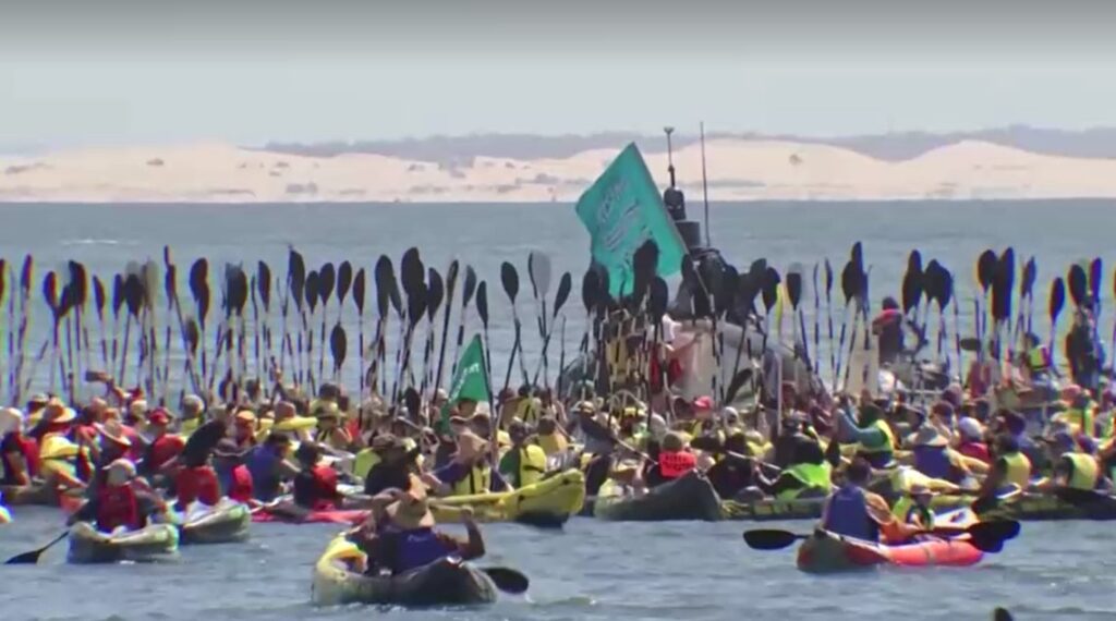 Australia climate change protest forces ship to abort arrival at coal port