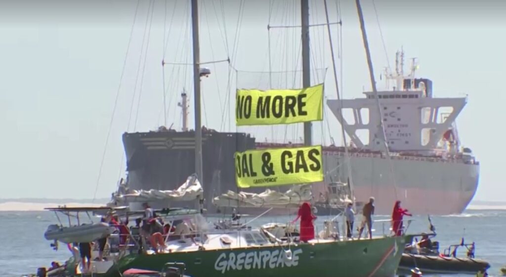 Australia climate change protest forces ship to abort arrival at coal port