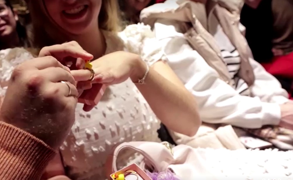 bride and groom exchanged rubber duck rings to celebrate their love