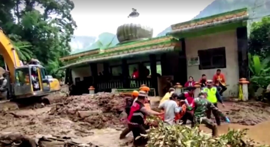 Rescuers dig through mud for survivors after landslides, floods kill 15 in Indonesia 