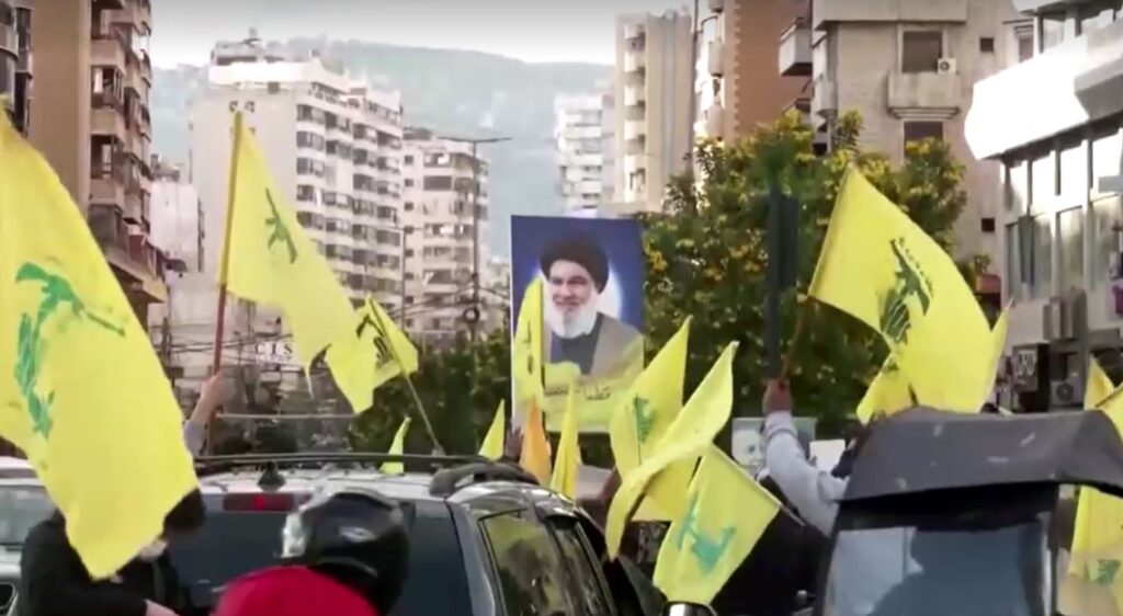 People return to Beirut waving Hezbollah flags as ceasefire with Israel takes effect