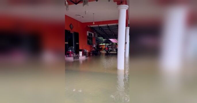 Homes under water in Malaysia as floods displace more than 90,000