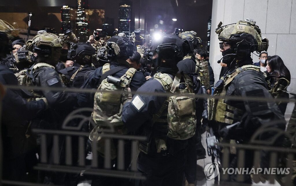 Martial law troops are spotted at the National Assembly compound in Seoul 