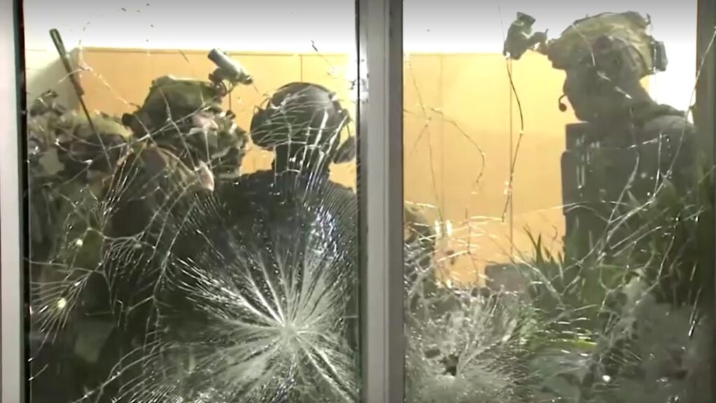 South Korean soldiers enter parliament through smashed windows