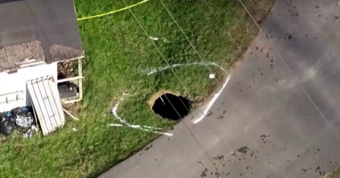 Search underway for woman who may have fallen into sinkhole while searching for her cat