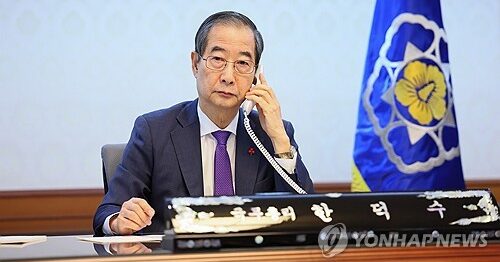 Acting President Han Duck-soo speaks with U.S. President Joe Biden