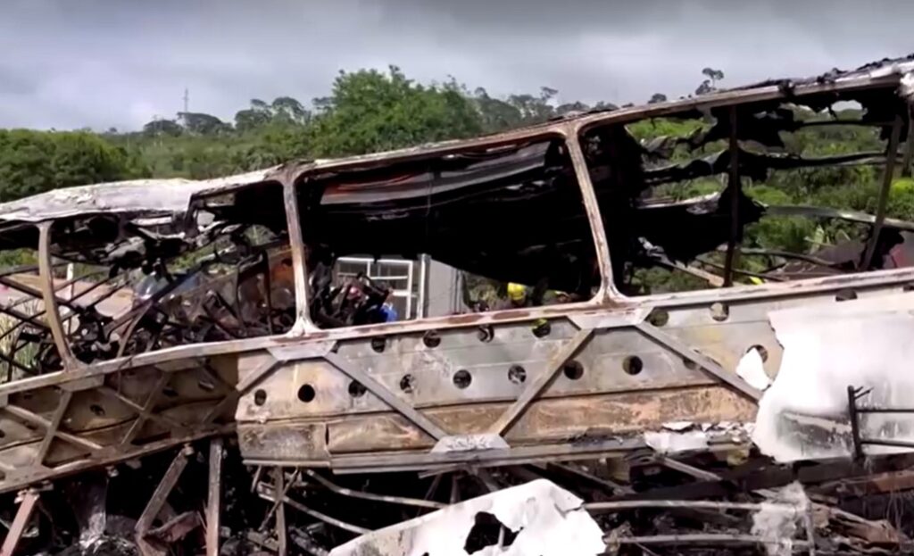 bus burnt after crashes truck on highway in Brazil