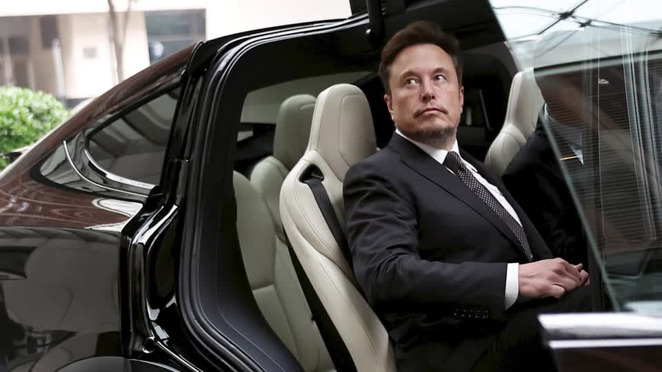 Elon Musk in a car