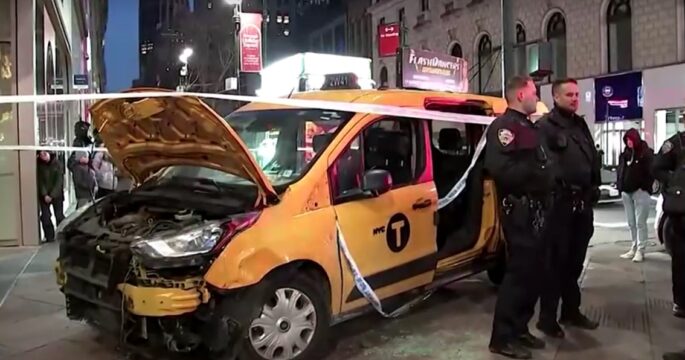 New York taxi jumps sidewalk outside Macy's on Christmas Day