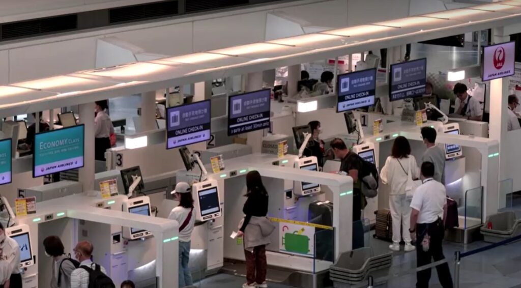 passengers at JAL check-in counters