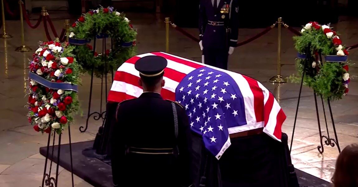 Jimmy Carter's flag-draped coffin under the Capitol dome