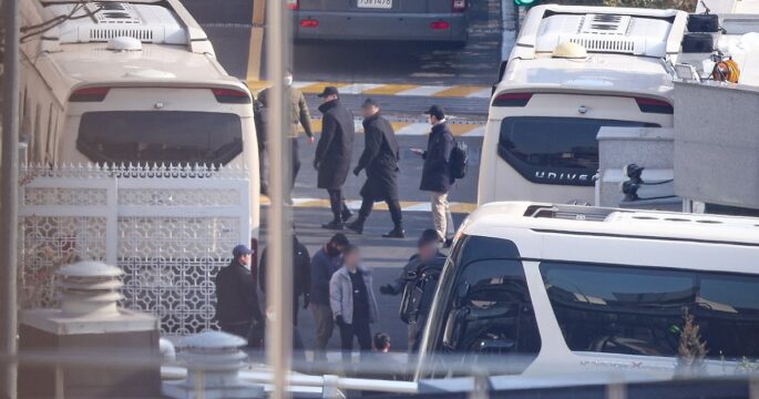 Buses parked at the entrance of President's official residence