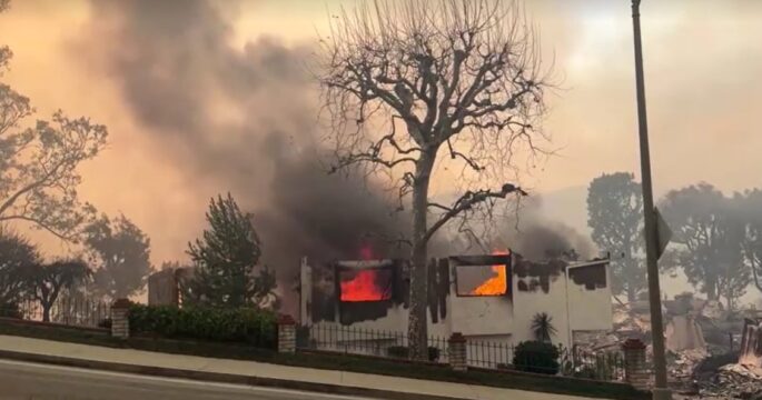 burned houses alongside of road in Pacific Palisades