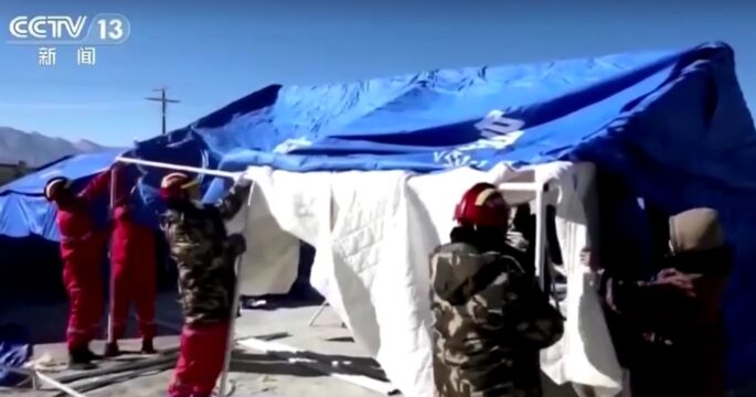 tents being built in area of earthquake in Tibet