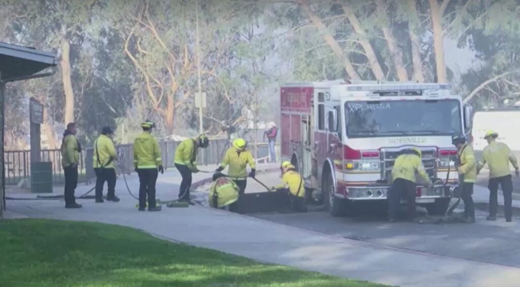 LA County Fire Department prepare fire hose