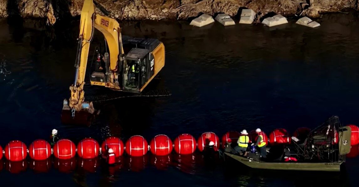 buoys barrier going up at US-Mexico border river