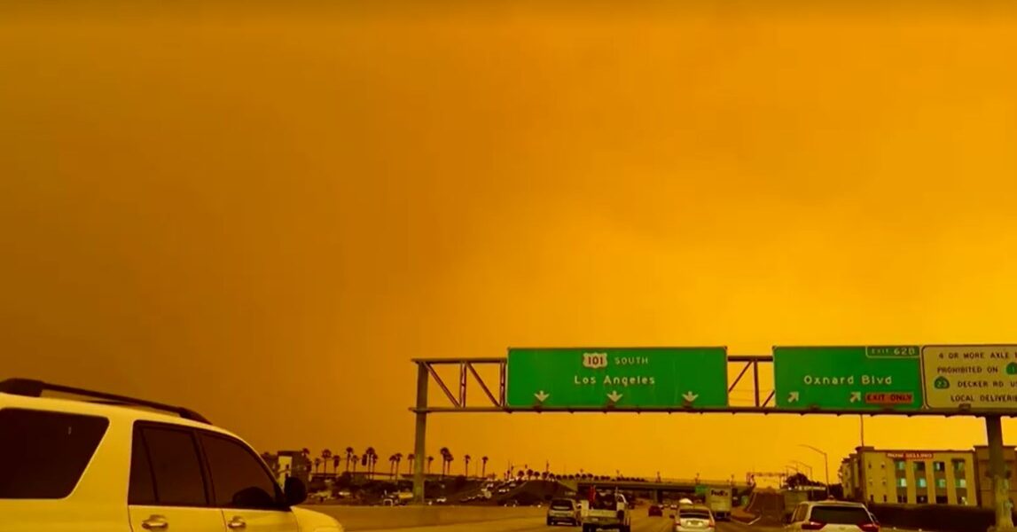 Sky over California turns orange, wildfire smoke envelopes highway