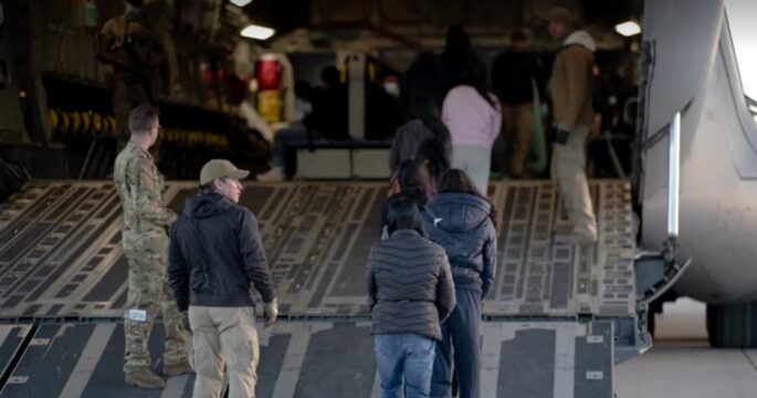 Undocumented migrants boarded onto U.S. military planes for deportation flights