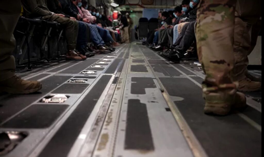 Undocumented migrants boarded onto U.S. military planes for deportation flights 