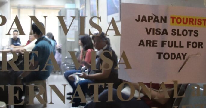 sign informing applicants that Japan tourist visa slots are full for the day