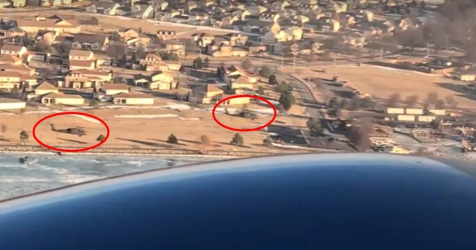 Passenger video taken week before crash shows helicopters flying alongside American Airline aircraft edit