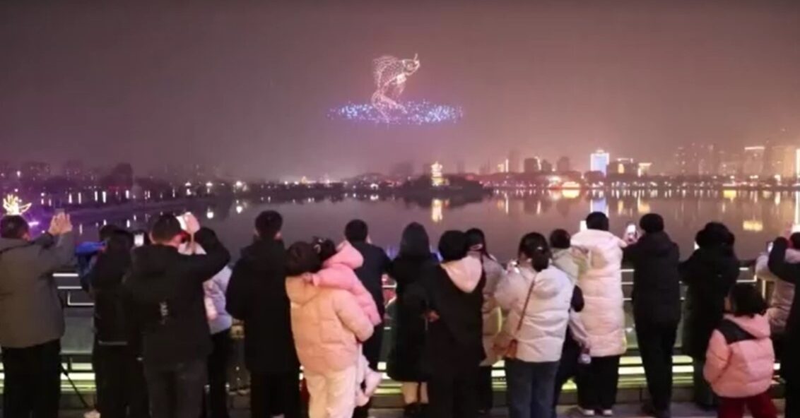 tourists watching drones in China