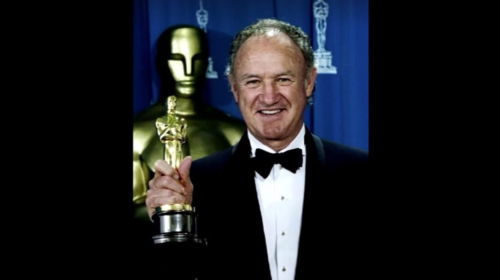 Gene Hackman holding his Oscar for best supporting actor for his role in Unforgiven in 1993