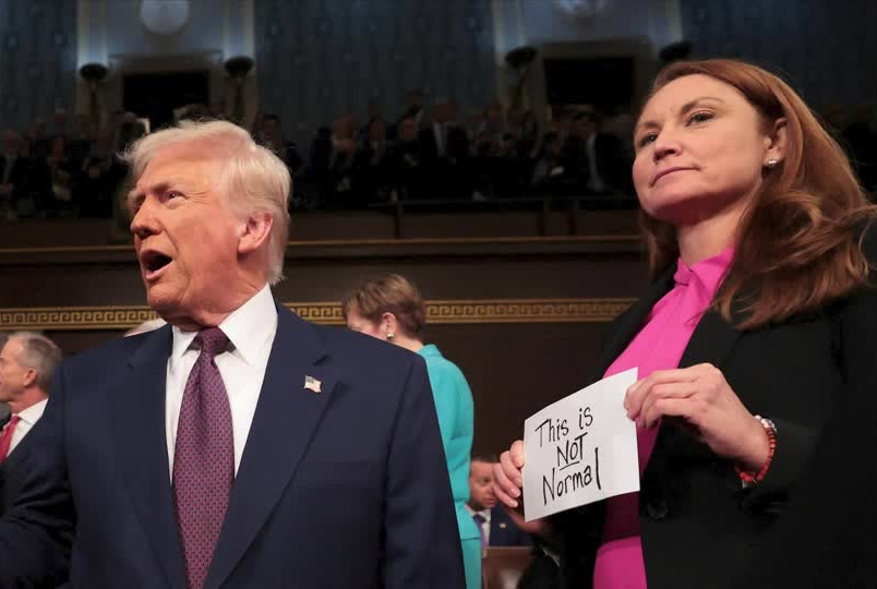 Democratic lawmakers wear pink as a protest at Trump's speech to Congress