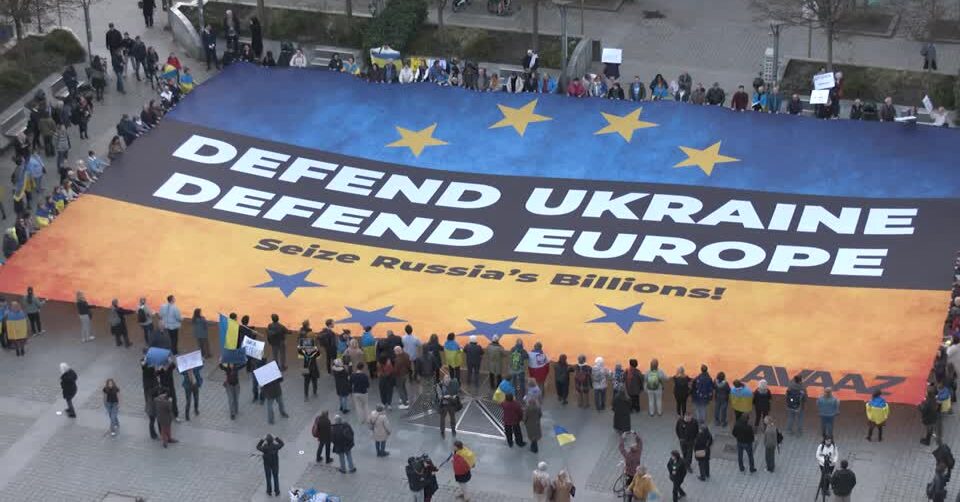 Massive Ukrainian flag unfurled in Brussels to urge seizing of frozen Russian assets