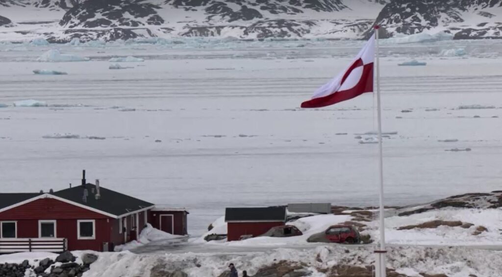 the coast of Nuuk, Greenland with National flag