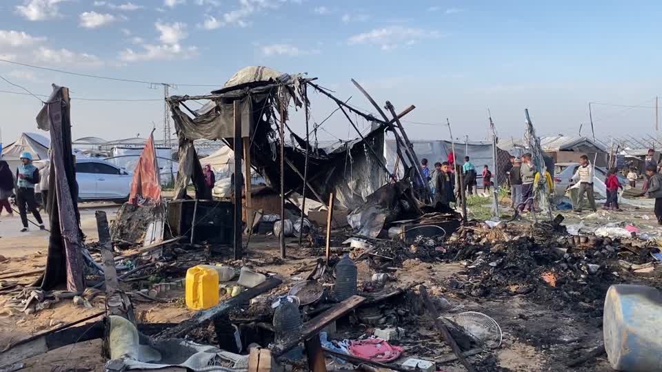 Israeli strikes burn displacement tents in Gaza's Khan Younis, mourners bid farewell to Victims