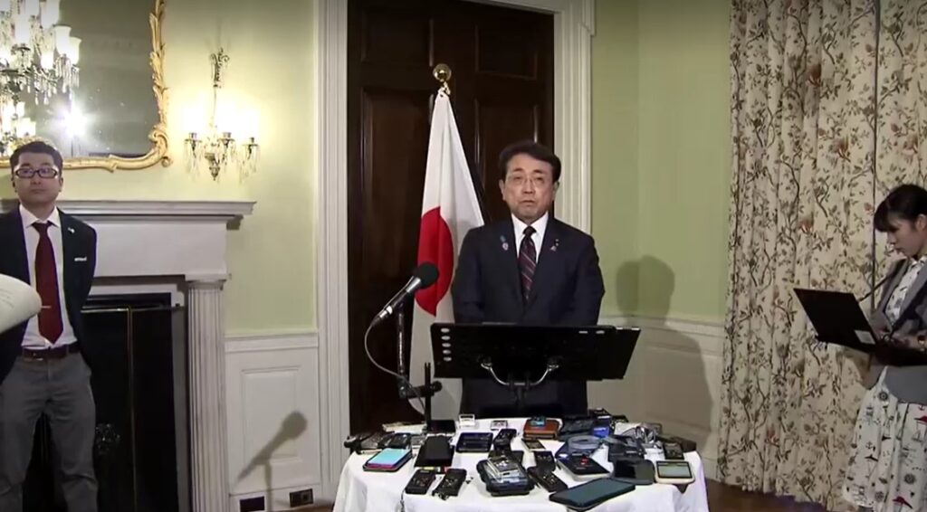 Japanese trade negotiator, Ryosei Akazawa, speaking to reporters