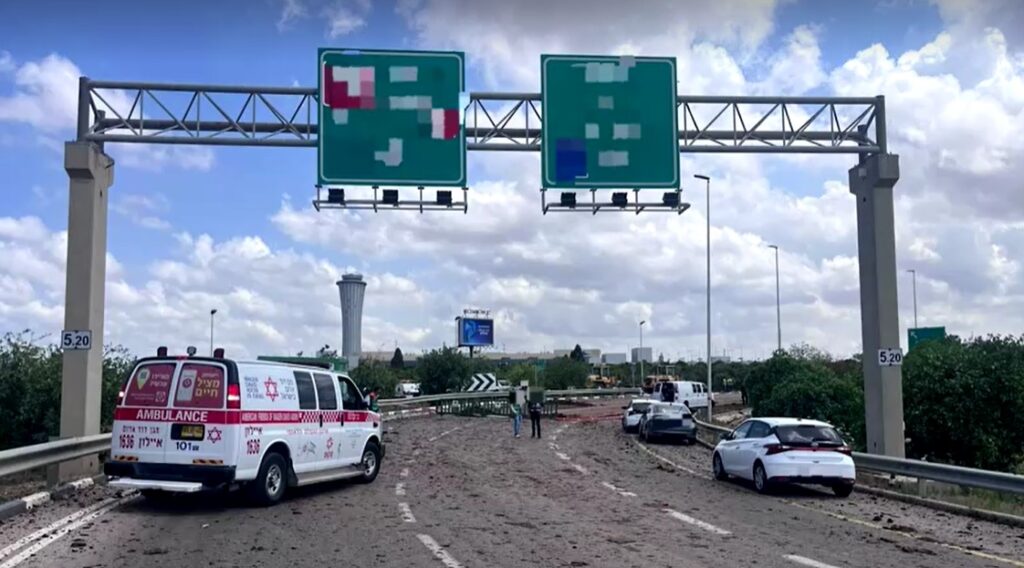 Projectile debris, crater created at site of missile strike from Yemen near Tel Aviv airport